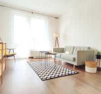 Bright living space with a sofa and an armchair in a 2-room apartment.