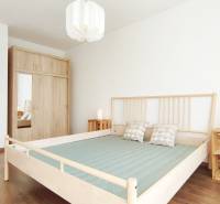 A bedroom with a wooden bed, built-in wardrobe, and nightstands in a two-room apartment.