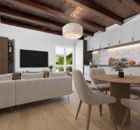 Living room with a wooden ceiling, kitchen, and dining area in a family house.