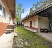 A family house on Dzurákovci Street in Brezová pod Bradlom with a yard and outdoor seating area.