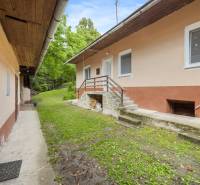 A family house on Dzurákovci Street in Brezová pod Bradlom with a green forecourt and stairs.