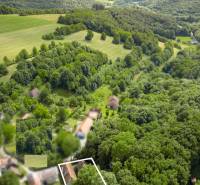 Aerial view of forests and landscape near a family house in Brezová pod Bradlom on Dzurákovci Street.
