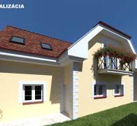 A family house in Bode Bánoš in Banská Bystrica with a yellow facade, French balcony.