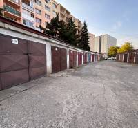 Garages on Považská Street, Košice - Západ district, surrounded by apartment buildings.
