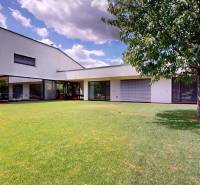 A family house on Longobardská Street in Bratislava - Rusovce with a spacious lawn.