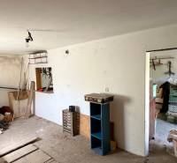 A room in a family house with stored items and clutter.