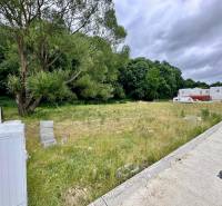 A plot in Borinka ideal for living, with a view of greenery and a nearby forest.