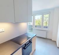 Kitchen in a 2-room apartment with a view, bright walls and windows.