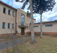 A two-story building among trees on Main Street in Dolná Strehová. Hotels and guesthouses.