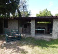 A cottage in Klížska Nemá with outdoor seating, a grill, and garden furniture.