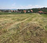 Building plots in Trenčianske Jastrabie with a view of the surrounding landscape and houses.