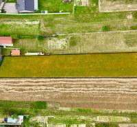 Aerial view of extensive properties - housing in Trenčianske Jastrabie surrounded by greenery and houses.