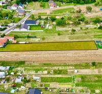 Panoramic view of residential plots in Trenčianske Jastrabie surrounded by houses.