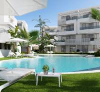 A swimming pool surrounded by loungers and palm trees at a 3-bedroom apartment on Santa Rosalia Lake street.