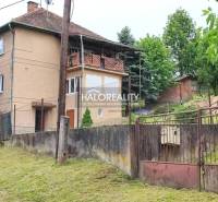 A family house in České Brezovy with a large garden, fencing, and a veranda.