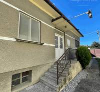 Family house in Veľké Blahovo with an entrance staircase and a side walkway.
