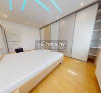 Bedroom in a 4-room apartment with built-in wardrobes and ceiling lighting.