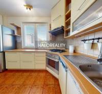 A kitchen in a 4-room apartment with a gas stove and a dishwasher.
