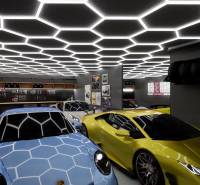 Luxury interior of commercial spaces with cars and unique ceiling design.