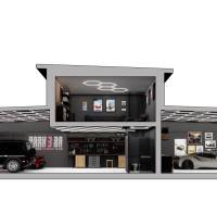 Stylish garage with luxury cars and a gallery, part of commercial premises.