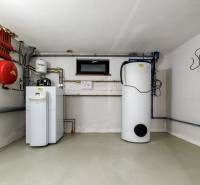 Heating and plumbing in the interior space of a family house, in clear light.