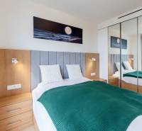 A cozy bedroom with a comfortable bed and a built-in wardrobe, 2-room apartment.