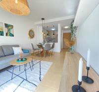 Living room in a 3-room apartment with comfortable seating and a dining area.