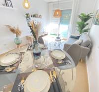 Dining room and living room in a 3-room apartment with subtle decor and furniture.
