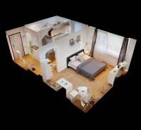 3D floor plan of a studio apartment with a bed, kitchenette, and table.