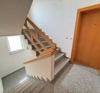 Staircase with wooden railing in a 3-room apartment, hr-reality, high-quality execution.