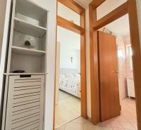 The hallway of a 3-room apartment with a view into the bedroom and bathroom.