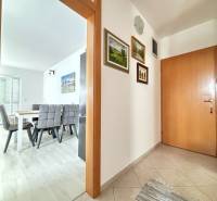 Interior of a 3-room apartment with a dining area and entrance hallway.
