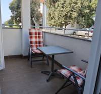 Balcony in a 2-room apartment in the city of Novalja with garden furniture.