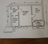 Floor plan of a 2-room apartment with a kitchen, room, bathroom, and terrace.