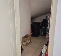 Storage space in a 2-room apartment with a slightly sloped ceiling, suitable for storage.