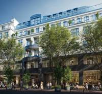 A building with commercial spaces surrounded by trees in Bratislava - Old Town on Poštová Street.
