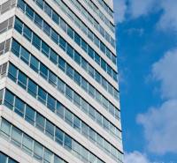 Building with glass windows and blue sky, Bratislava - Karlova Ves, Dúbravská cesta, offices.