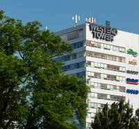 Westend Tower building among the trees on Dúbravská cesta in Bratislava - Karlova Ves.