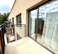 Balcony of a 2-room apartment in Senica on Sadova Street with a green view.