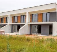 A newly built family house in Piešťany with a garden and large windows.