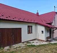 A family house on Dlha Street in Vranov nad Topľou with a red roof and two doors.