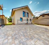 A family house in Rimavská Sobota with a paved yard and lawn on a spacious plot.