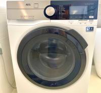 AEG washing machine with multiple programs in a 2-room apartment.