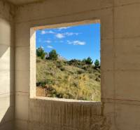 View from the unfinished Villa to nature with a blue sky.