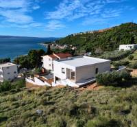 Villa in Duće with a view of the sea and surrounding hills.