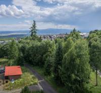 View of greenery and mountain landscape from a 3-room apartment in the High Tatras.