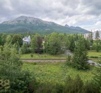 A view from a 3-room apartment in the High Tatras of majestic mountains and dense forests.