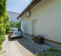 A car parked on the sidewalk next to a family house on Chrasťová Street, Bratislava - Nové Mesto.