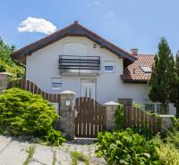 A family house on Chrasťová Street in Bratislava - Nové Mesto with a garden and a wooden fence.