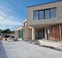 A villa in Vodice during construction works with exterior materials and a view of the surroundings.